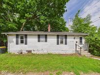 Charming single-story home with classic white siding, black shutters, and well-maintained front lawn at 903 W 22Nd St, Anderson, IN 46016