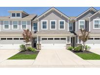 Inviting exterior of a two-story home featuring a two-car garage and well-maintained landscaping at 9570 Beckett St, Avon, IN 46123