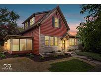 Charming two-story home with a well-maintained lawn and stone accents for added curb appeal at 1497 Clinton St, Noblesville, IN 46060