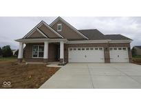 Charming brick home featuring a two-car garage, covered entry, and shingle details at 5032 Carmine St, Brownsburg, IN 46112