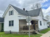 Charming two-story home with a welcoming front porch and manicured lawn at 600 S Oak St, Fortville, IN 46040