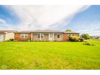 Charming single-story home with a well-maintained lawn and inviting entrance at 6863 W Jennifer Ct, Greenfield, IN 46140