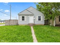 Charming single-story home with gray siding, white trim, and a well-maintained lawn at 703 Kappes St, Indianapolis, IN 46221