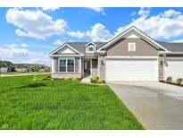 Charming single-Gathering home featuring a two-car garage and well-manicured front yard with irrigation at 104 Maxim Ct, Cumberland, IN 46229