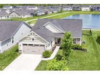 Beautiful single-Gathering home with well-manicured lawn and a pond view at 1530 Gristmill Meadows Dr, Westfield, IN 46074