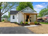 White brick home with new landscaping and a driveway leading to the entrance at 650 Overstreet St, Franklin, IN 46131