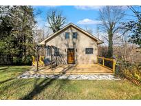 Charming home with a beautiful front deck, complete with a cozy swing and lovely landscaping at 7335 Bethany Park, Martinsville, IN 46151