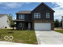 Charming two-story home featuring a modern design, stone accents, and a spacious two-car garage at 7517 Big Bend Blvd, Camby, IN 46113