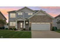 Beautiful two-story home featuring stone accents, a two-car garage, and a well-manicured front lawn at 951 Parker Ln, Westfield, IN 46074