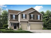 Charming townhome featuring a two-car garage and inviting covered entrance with shingle and siding details at 3882 Andean Ct, Bargersville, IN 46106