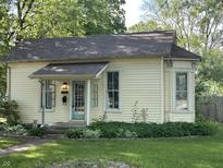 Charming home featuring an inviting front porch, neat landscaping, and neutral-colored exterior at 404 Pearl St, Pendleton, IN 46064