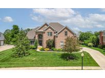 Beautiful two-story brick home featuring a manicured front yard and long driveway at 4368 W Eagle Trce, New Palestine, IN 46163