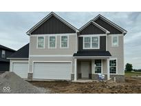 New two-story home featuring a two-car garage and a welcoming front porch at 6421 Springtide Ct, Plainfield, IN 46168