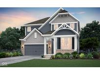 Beautiful two-story home with gray siding, stone accents, a covered porch, and well-manicured landscaping at 6833 Jacone Dr, Brownsburg, IN 46112