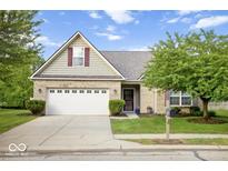 Charming single-Gathering home with well-maintained lawn, mature trees, and a two-car garage at 7242 Blue Ridge Dr, Noblesville, IN 46062