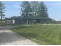 Ranch-style home with green lawn and gravel driveway at 732 W 700 N, Fortville, IN 46040