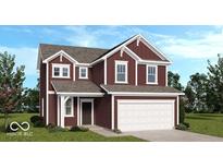 Two-story home featuring a red siding, white trim, a two car garage, and a well manicured front yard at 1943 Black Oak Dr, Shelbyville, IN 46176