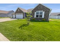 Charming home featuring a well-manicured lawn and a neatly designed exterior at 2913 Lily Dr, Lebanon, IN 46052