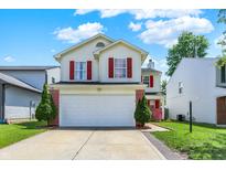 Charming two-story home featuring red shutters, a two-car garage, and a well-maintained front yard at 539 Deer Trail Dr, Indianapolis, IN 46217