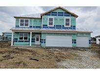 New construction home featuring a two-car garage and modern architectural design at 6031 Madera Dr, Whitestown, IN 46075