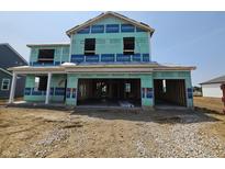 View of a two-story home under construction with visible framing and protective wrap at 6031 Madera Dr, Whitestown, IN 46075