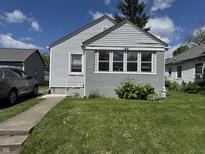 Charming home featuring well-maintained lawn, and a gray painted brick facade at 144 S 7Th Ave, Beech Grove, IN 46107