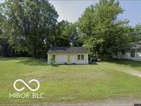 Charming single-story home with well-maintained lawn and mature trees at 1801 E 16Th St, Muncie, IN 47302