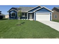 Charming single-story home with blue siding, a well-manicured lawn and a bright white garage door at 223 N Coventry Dr, Anderson, IN 46012