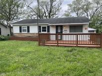 Charming home featuring a inviting front porch, and tidy landscaping, with a secure Vivint system installed at 3208 Wellington Ave, Indianapolis, IN 46226