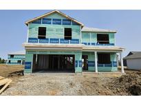 New two-story home under construction featuring a two-car garage in a residential neighborhood at 6038 Granby Dr, Whitestown, IN 46075