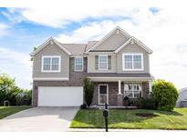 Beautiful two-story home with a well-manicured lawn and attached two car garage at 635 Sonoma Ln, Greenfield, IN 46140