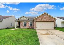 Charming brick home featuring an attached two-car garage and a well-maintained front lawn at 8904 Browns Valley Ln, Camby, IN 46113