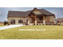 Charming one-story home featuring a covered porch with stone columns and a well-manicured lawn at Lot 2 Vanderbilt Dr, Anderson, IN 46011