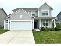 Charming two-story home with a well-manicured lawn, white garage door, and welcoming front porch at 1880 Explorer Ct, Franklin, IN 46131