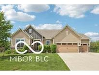 Charming single-story home with a well-maintained lawn and a two-car garage at 19175 English Lake Ln, Noblesville, IN 46062