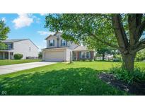 Charming two-story home with well-maintained lawn, attached garage, and beautiful curb appeal at 237 Broadmoor Bnd, Pittsboro, IN 46167
