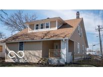 Charming home featuring a well-maintained lawn and traditional architecture at 2968 N Arsenal Ave, Indianapolis, IN 46218