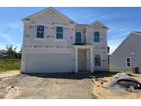 New two-story home featuring an attached two-car garage and classic architectural details at 3897 Berkdale Ct, Columbus, IN 47203