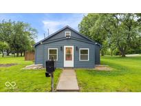 Charming single-story home with neat landscaping, a new roof, and a welcoming front door at 450 Pleasant St, Noblesville, IN 46060