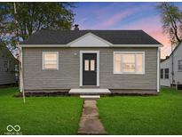 Charming single-story home featuring a well-manicured lawn and inviting entrance at 618 Miller Ave, Shelbyville, IN 46176