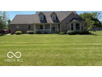 Charming single-Gathering home boasting a meticulously maintained lawn and inviting front porch at 916 N County Road 500 E, Avon, IN 46123