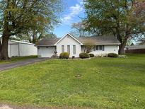 Charming single-story home with manicured front yard and driveway at 1011 N 10Th St, Elwood, IN 46036