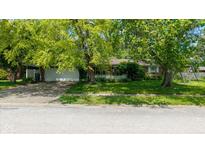 Charming one-story brick home with a two car garage and a lovely white picket fence at 1416 Miami S Ct, Plainfield, IN 46168