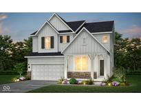 Charming two-story home featuring white siding, black shutters, stone accents, and a well-manicured lawn at 2705 Penn Ave, Plainfield, IN 46168