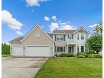 Charming two-story home with a manicured lawn, three-car garage, and lovely curb appeal at 1029 Bridgeport Dr, Westfield, IN 46074