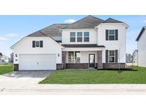 Beautiful two-story home with a two-car garage, brick accents, and manicured lawn at 18967 Seaforth Way, Westfield, IN 46074
