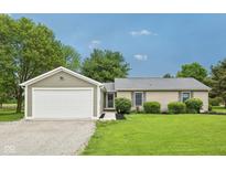 Charming single-story home with attached garage, well-maintained lawn, and classic curb appeal at 3020 E 400 S, Lebanon, IN 46052