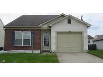 Charming single Gathering home featuring a well maintained lawn and a one car garage at 3908 Roundwood Dr, Indianapolis, IN 46235