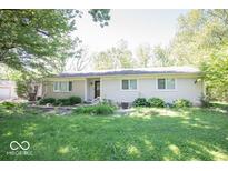 Charming single-story home with a well-maintained lawn and mature trees, offering great curb appeal at 4023 Cedar Hills South Dr, Greenwood, IN 46143