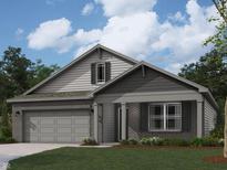 Charming single-story home with brick facade, covered entry, and landscaped front yard at 6024 Granby Dr, Whitestown, IN 46075